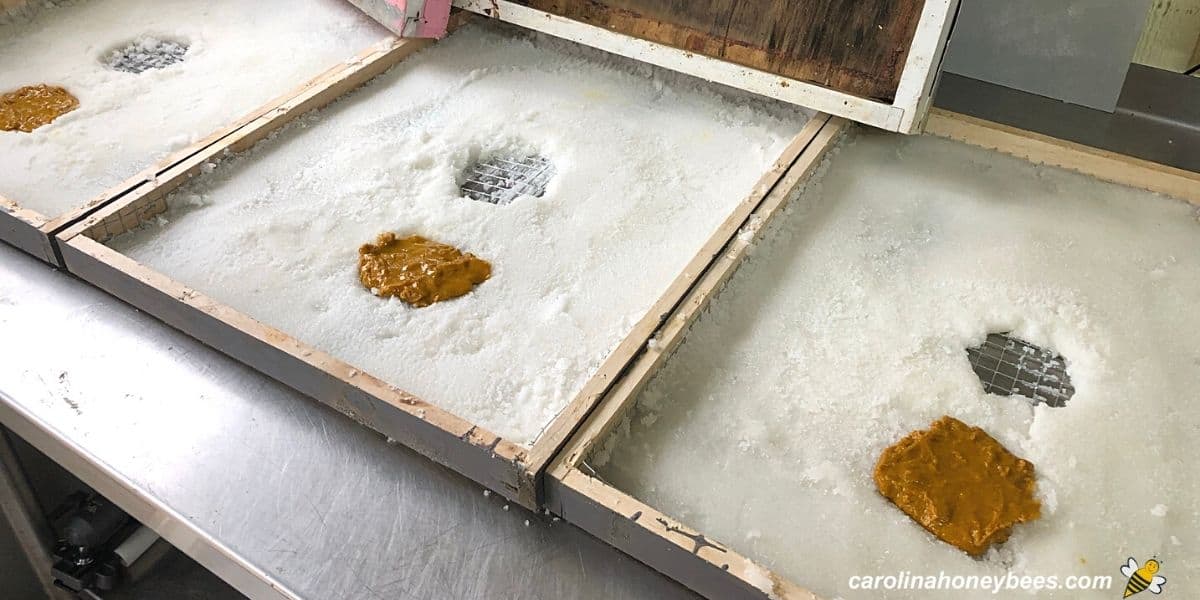 Three DIY candy boards ready for placing on beehives.