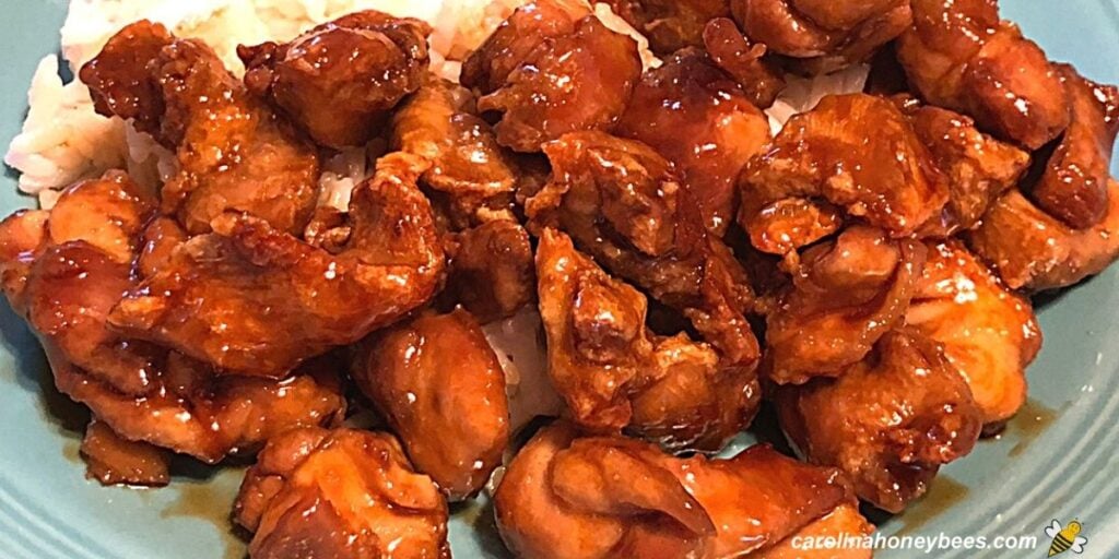 Air fried honey chicken chunks on plate image.