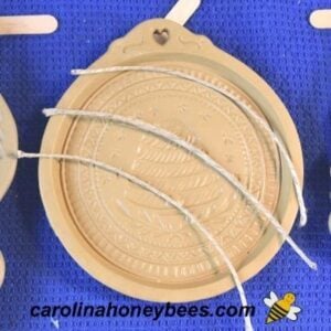 Sections of jute twine to make hanger for blackened beeswax ornament image.