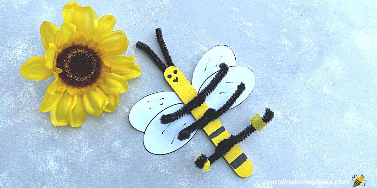 Easy honey bee craft project for kids to make using craft sticks and pipe cleaners.