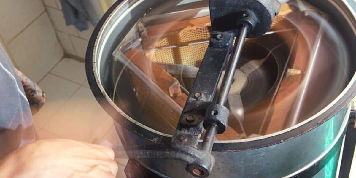Three frame manual honey extractors image.