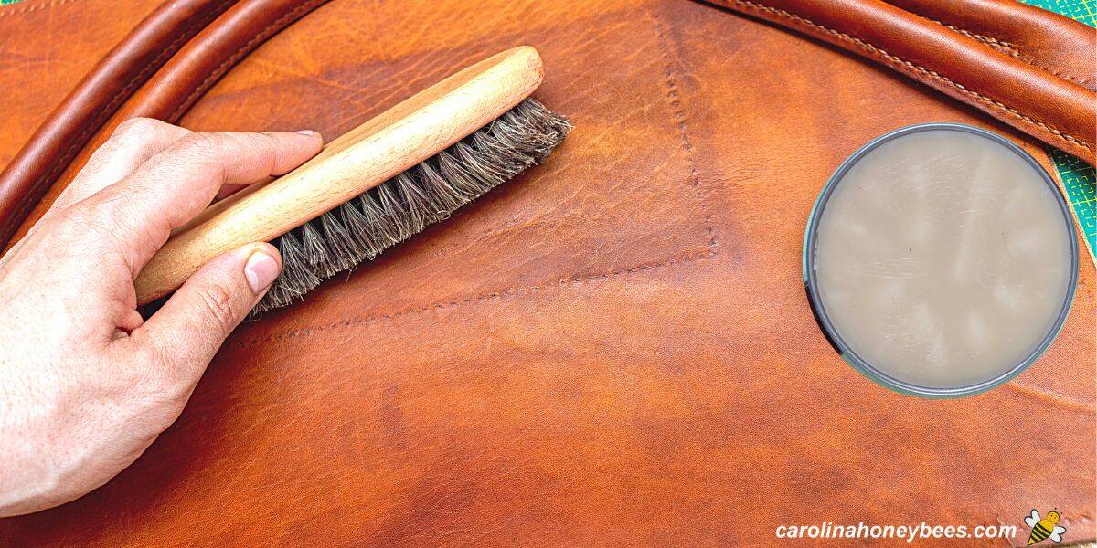 Conditioning leather with a brush and can of homemade beeswax polish.
